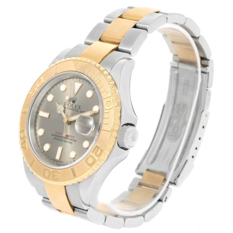 The Rolex Yacht-Master 16623 Men's Stainless Steel Grey Dial 16623 Men's Stainless Steel Grey Dial watch is shown at a three-quarter angle, displaying its silver and gold bezel, bracelet, and dial with a date window.