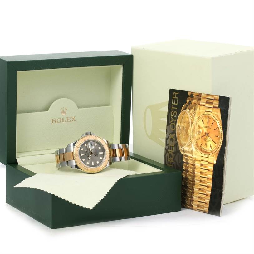 The Rolex Yacht-Master 16623 Men's Stainless Steel Grey Dial 16623 Men's Stainless Steel Grey Dial watch is displayed in its box, with the watch face and bracelet clearly visible along with the accompanying booklet.