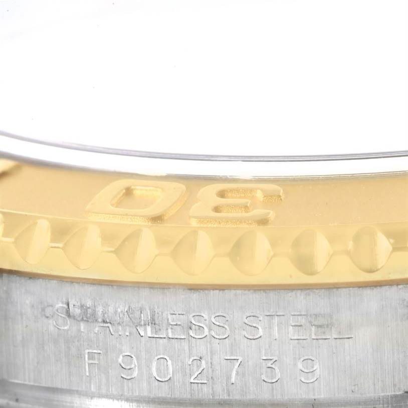 Close-up of the Rolex Yacht-Master 16623 Men's Stainless Steel Grey Dial 16623 Men's Stainless Steel Grey Dial bezel with engraved numbers and part of the stainless steel case visible.