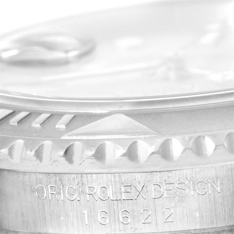 Close-up of the Yacht-Master model by Rolex showing part of the bezel and case with model engraving "ORIG. ROLEX DESIGN 16622".