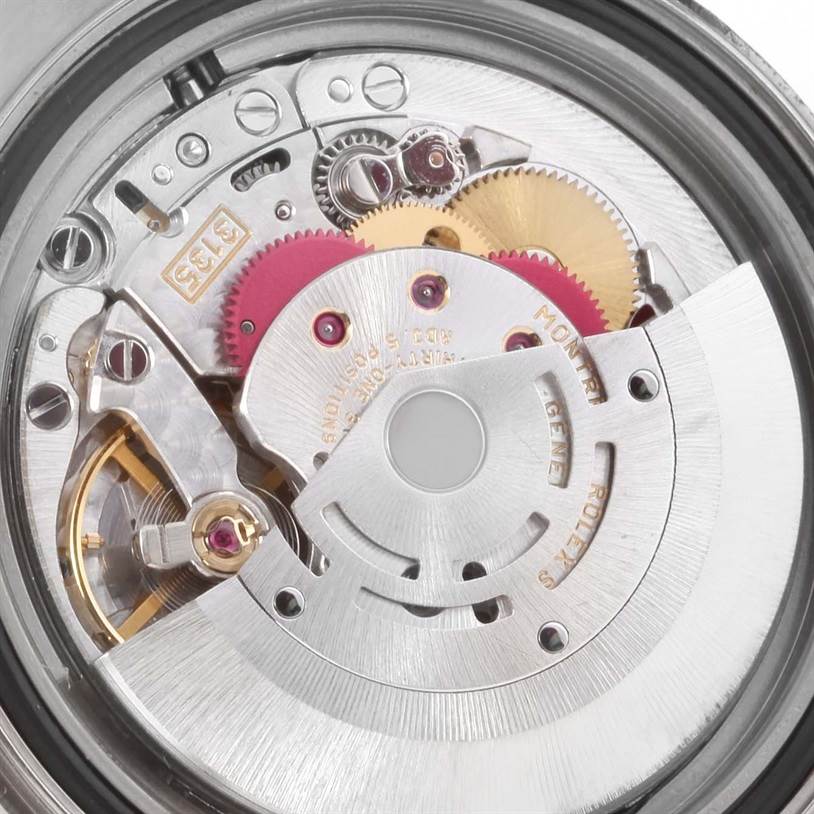 This close-up image shows the internal mechanism of the Rolex Yacht-Master 16622 Men's Stainless Steel Silver Dial 16622 Men's Stainless Steel Silver Dial watch, highlighting its gears and rotor.