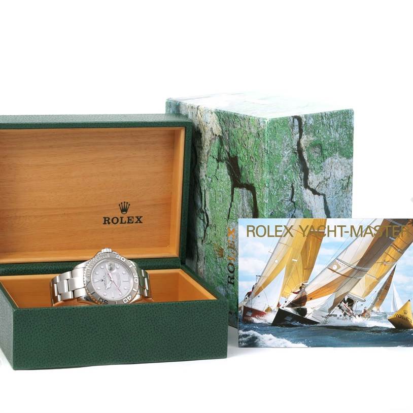 The image shows a Rolex Yacht-Master 16622 Men's Stainless Steel Silver Dial 16622 Men's Stainless Steel Silver Dial watch in its open case with the outer box and booklet.