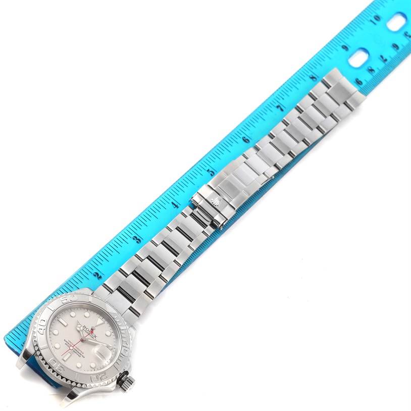 The image shows a Rolex Yacht-Master 16622 Men's Stainless Steel Silver Dial 16622 Men's Stainless Steel Silver Dial watch laid flat next to a ruler, displaying the bracelet and watch face.