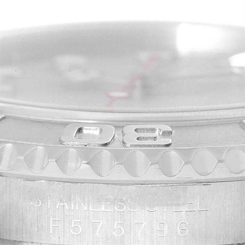 This close-up angle of the Rolex Yacht-Master 16622 Men's Stainless Steel Silver Dial 16622 Men's Stainless Steel Silver Dial shows part of the bezel and the watch's serial number on the case.