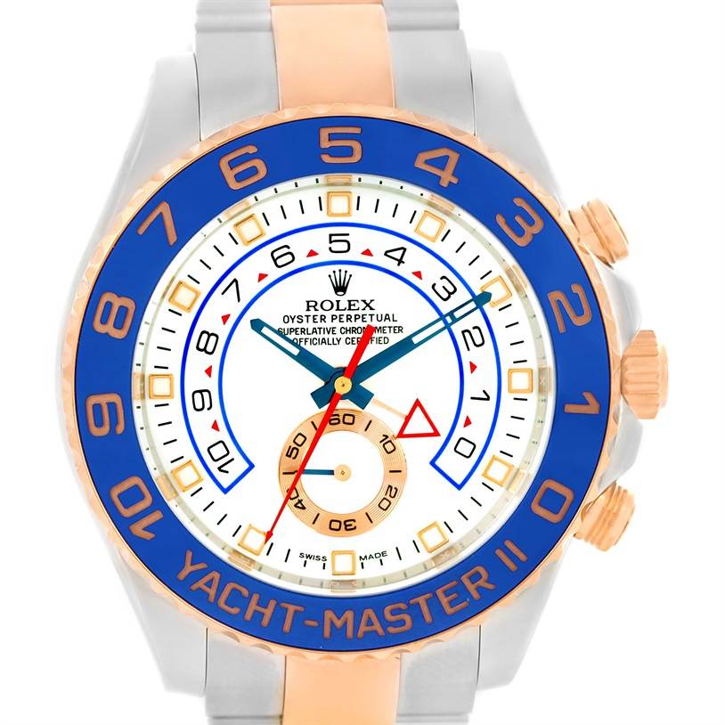 The image shows a Rolex Yacht-Master 116681 Men's Steel and Gold (two tone) White Dial 116681 Men's Steel and Gold (two tone) White Dial II watch from a front angle, highlighting its dial, bezel, and buttons.