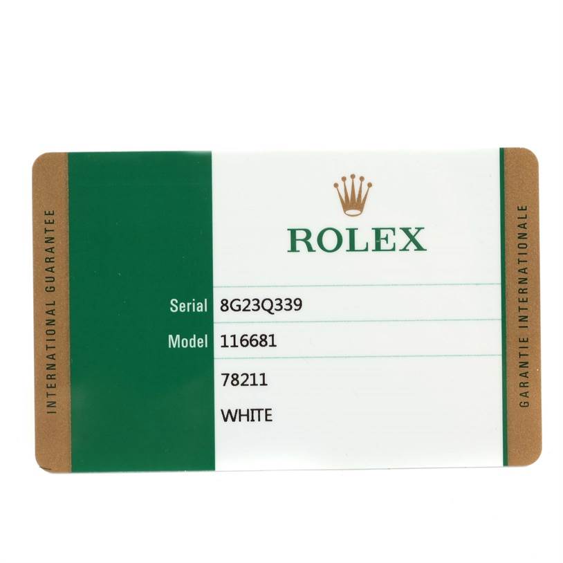The image shows an international guarantee card for the Rolex Yacht-Master 116681 Men's Steel and Gold (two tone) White Dial 116681 Men's Steel and Gold (two tone) White Dial watch, featuring serial and model numbers.