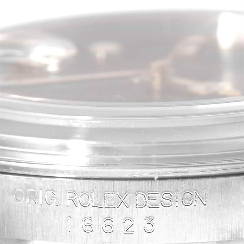 Close-up of a Rolex Yacht-Master 16623 Men's Stainless Steel Mother of Pearl Dial 16623 Men's Stainless Steel Mother of Pearl Dial watch showing the side profile with the words "ORIG. ROLEX DESIGN 16623" engraved.