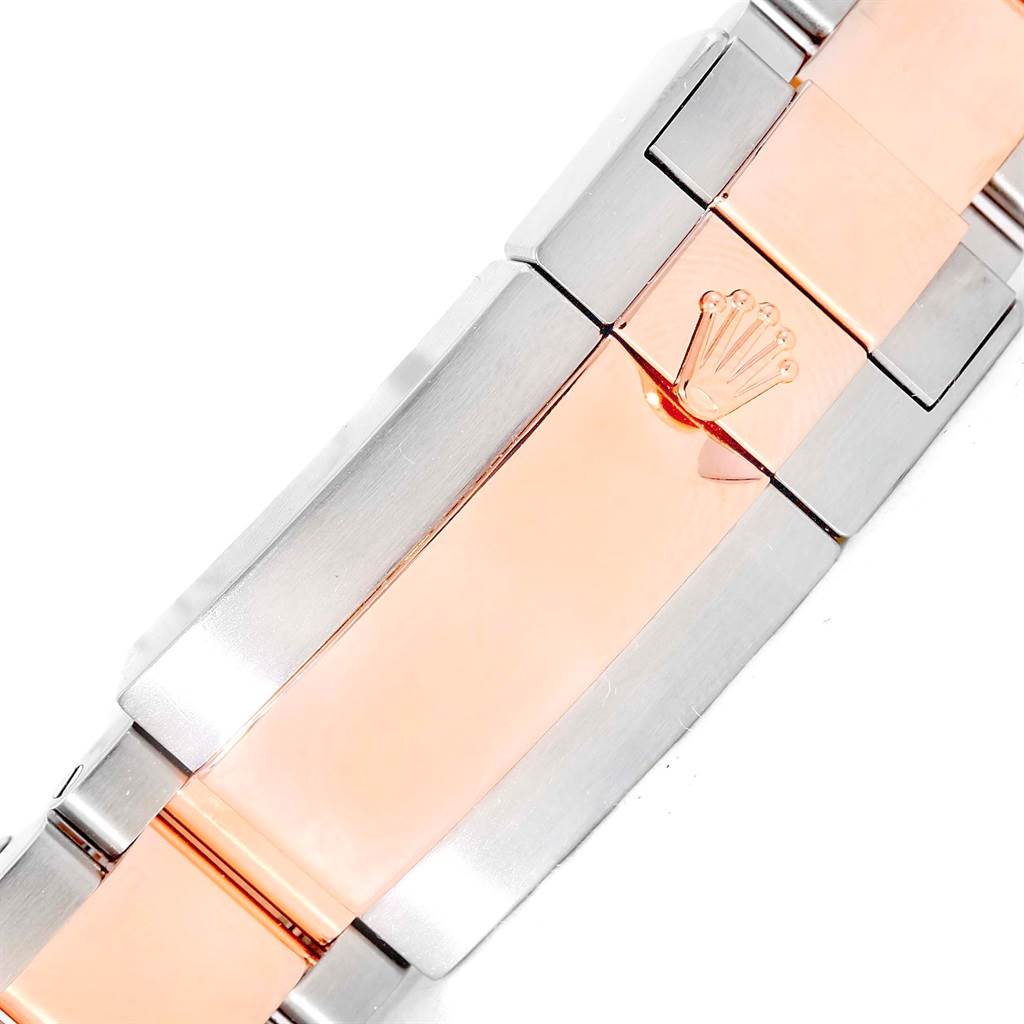 The image shows a top view of the clasp and bracelet of a Rolex Yacht-Master 116681 Men
s Steel and Gold (two tone) White Dial 116681 Men
s Steel and Gold (two tone) White Dial watch.