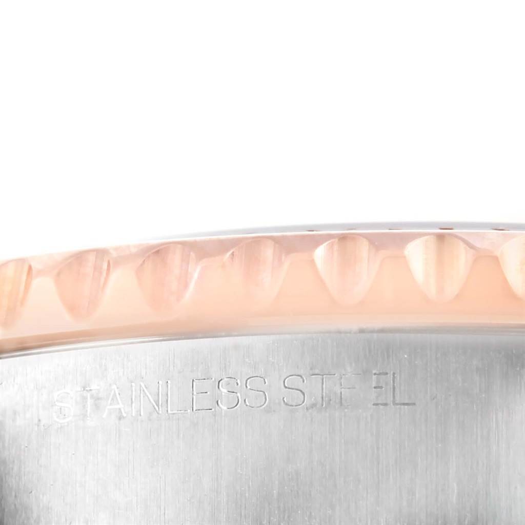 This close-up angle shows the edge of the bezel and part of the stainless steel case of the Rolex Yacht-Master 116681 Men
s Steel and Gold (two tone) White Dial 116681 Men
s Steel and Gold (two tone) White Dial watch.