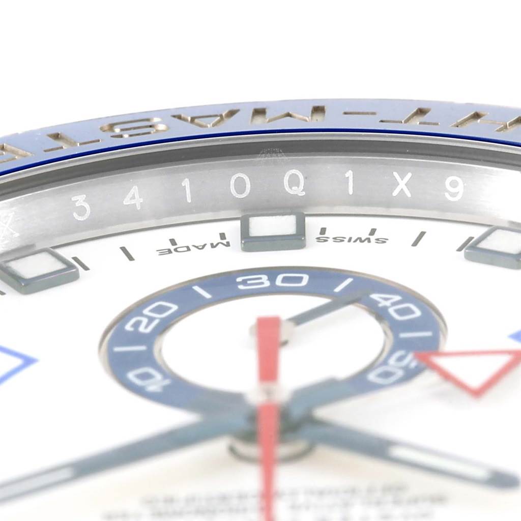 This close-up image of the Rolex Yacht-Master 116680 Men's Stainless Steel White Dial 116680 Men's Stainless Steel White Dial watch shows the upper portion of the dial and bezel, displaying numeral details.