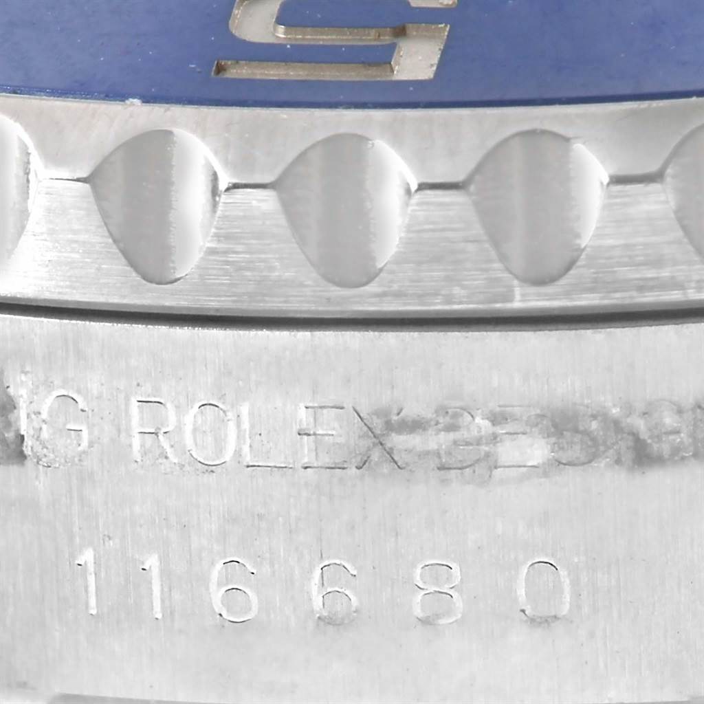 The image shows a close-up of the bezel and the engraved serial number on a Rolex Yacht-Master 116680 Men's Stainless Steel White Dial 116680 Men's Stainless Steel White Dial watch.