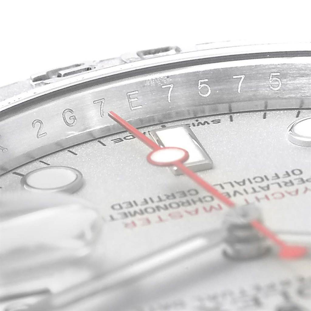 This image shows a close-up angle of the Rolex Yacht-Master 116622 Men's Stainless Steel Silver Dial 116622 Men's Stainless Steel Silver Dial watch's dial, bezel, and partially visible serial number.