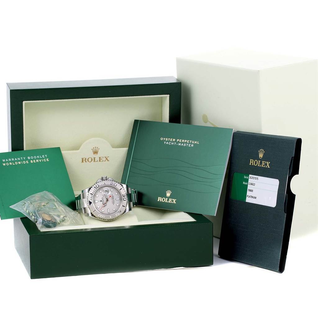 The image shows a Rolex Yacht-Master 116622 Men's Stainless Steel Silver Dial 116622 Men's Stainless Steel Silver Dial watch in its case, along with booklets and accessories, displayed at an angle from the front.