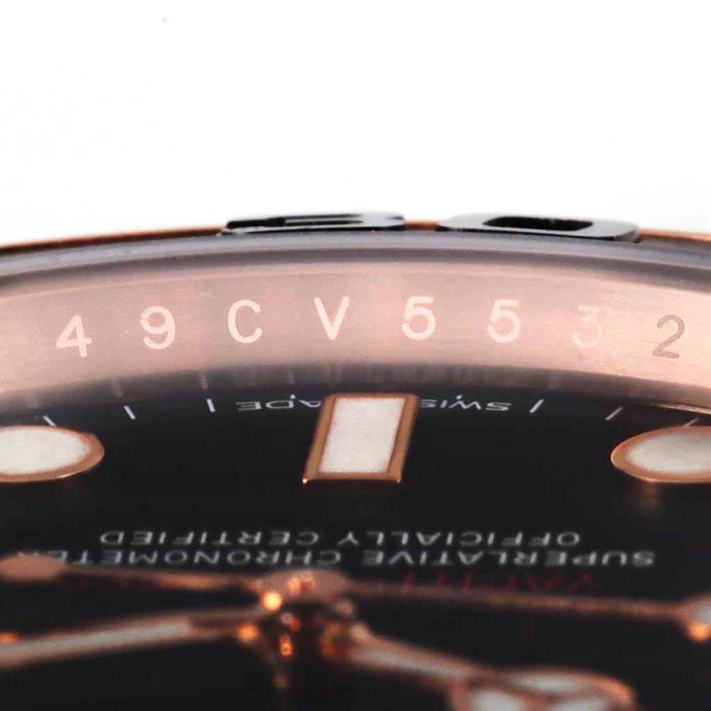 The image shows a close-up view of the top edge and part of the dial of a Rolex Yacht-Master 116655 Men's Rose Gold Black Dial 116655 Men's Rose Gold Black Dial watch.