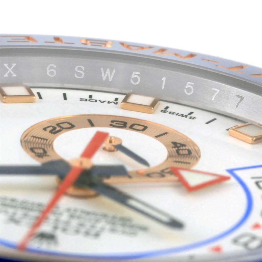 The image shows a close-up angle of the Rolex Yacht-Master 116681 Men's Steel and Gold (two tone) White Dial 116681 Men's Steel and Gold (two tone) White Dial watch face, highlighting the hands, markers, and part of the bezel.