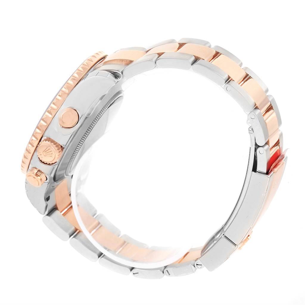 The image shows a side view of a Rolex Yacht-Master 116681 Men's Steel and Gold (two tone) White Dial 116681 Men's Steel and Gold (two tone) White Dial watch featuring the bracelet, crown, and part of the bezel.