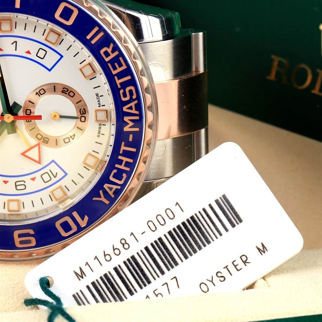 The image shows a close-up of the dial, bezel, and part of the bracelet of a Rolex Yacht-Master 116681 Men's Steel and Gold (two tone) White Dial 116681 Men's Steel and Gold (two tone) White Dial watch.