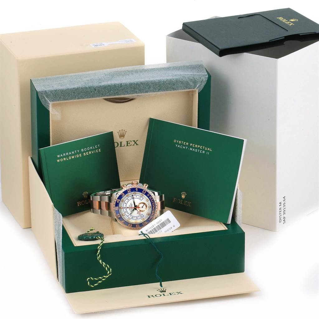 The image shows a Rolex Yacht-Master 116681 Men's Steel and Gold (two tone) White Dial 116681 Men's Steel and Gold (two tone) White Dial watch with its box, warranty booklet, and manual from a front angle.