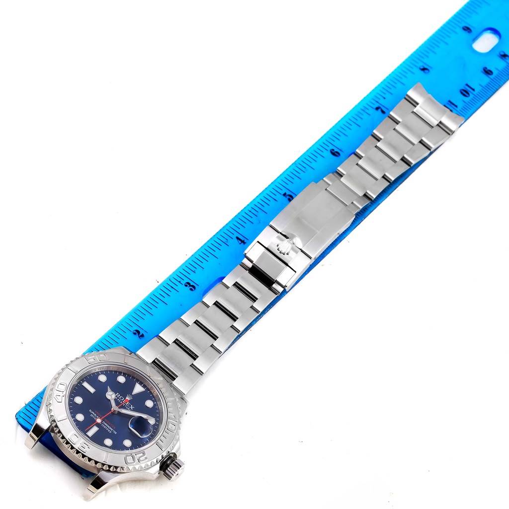 This image shows the Rolex Yacht-Master 116622 Men's Stainless Steel Blue Dial 116622 Men's Stainless Steel Blue Dial watch from a top-down angle, including the face, bezel, bracelet, and clasp, alongside a ruler for scale.