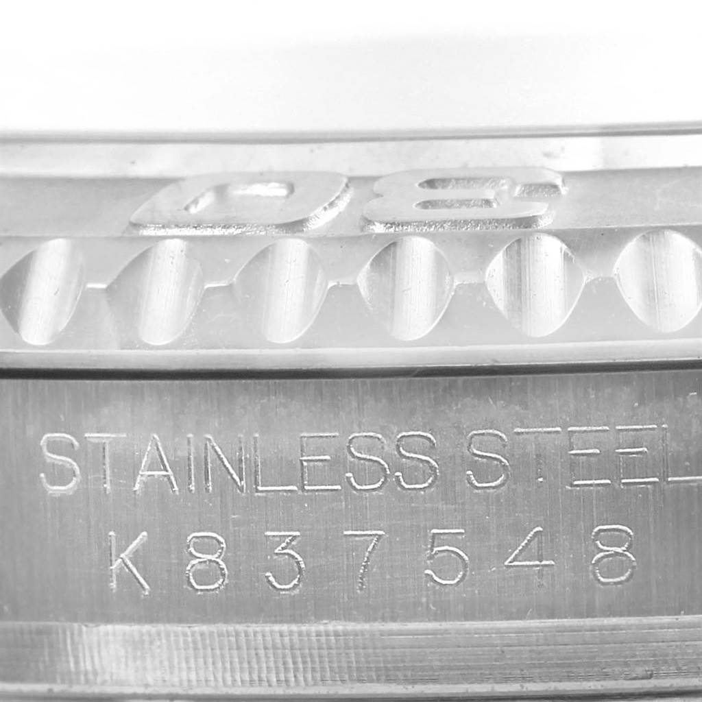 This image shows a close-up of the stainless steel case back and bezel edge of a Rolex Yacht-Master 16622 Men's Stainless Steel Silver Dial 16622 Men's Stainless Steel Silver Dial watch.