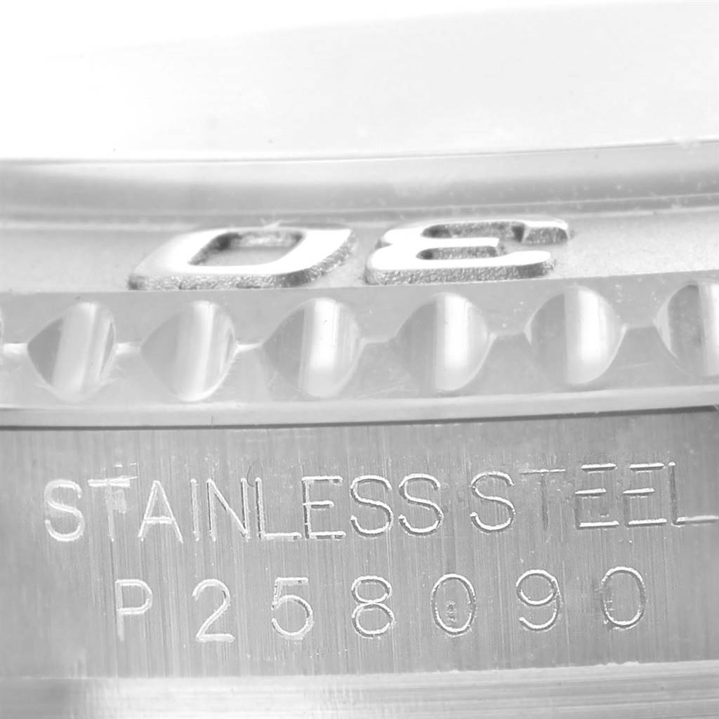 The image shows a close-up of the bezel and the engraved serial number on the stainless steel side of a Rolex Yacht-Master 16622 Men's Stainless Steel Silver Dial 16622 Men's Stainless Steel Silver Dial watch.