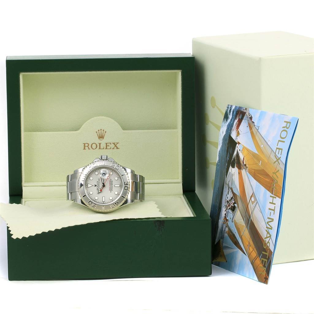 The Rolex Yacht-Master 16622 Men's Stainless Steel Silver Dial 16622 Men's Stainless Steel Silver Dial watch is displayed in its open box with a booklet and cleaning cloth.