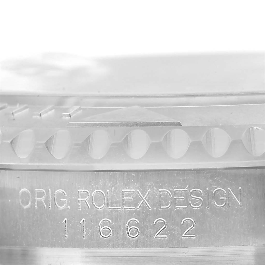 The image shows a close-up of the engraving "ORIG. ROLEX DESIGN 116622" on the side of the bezel of a Rolex Yacht-Master 116622 Men's Stainless Steel Silver Dial 116622 Men's Stainless Steel Silver Dial watch.