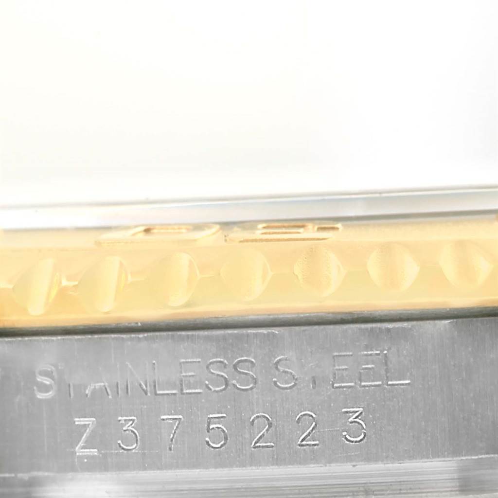 This close-up image shows the side engraving of a Rolex Yacht-Master 16623 Men's Stainless Steel Mother of Pearl Dial 16623 Men's Stainless Steel Mother of Pearl Dial watch, highlighting the serial number and stainless steel material.