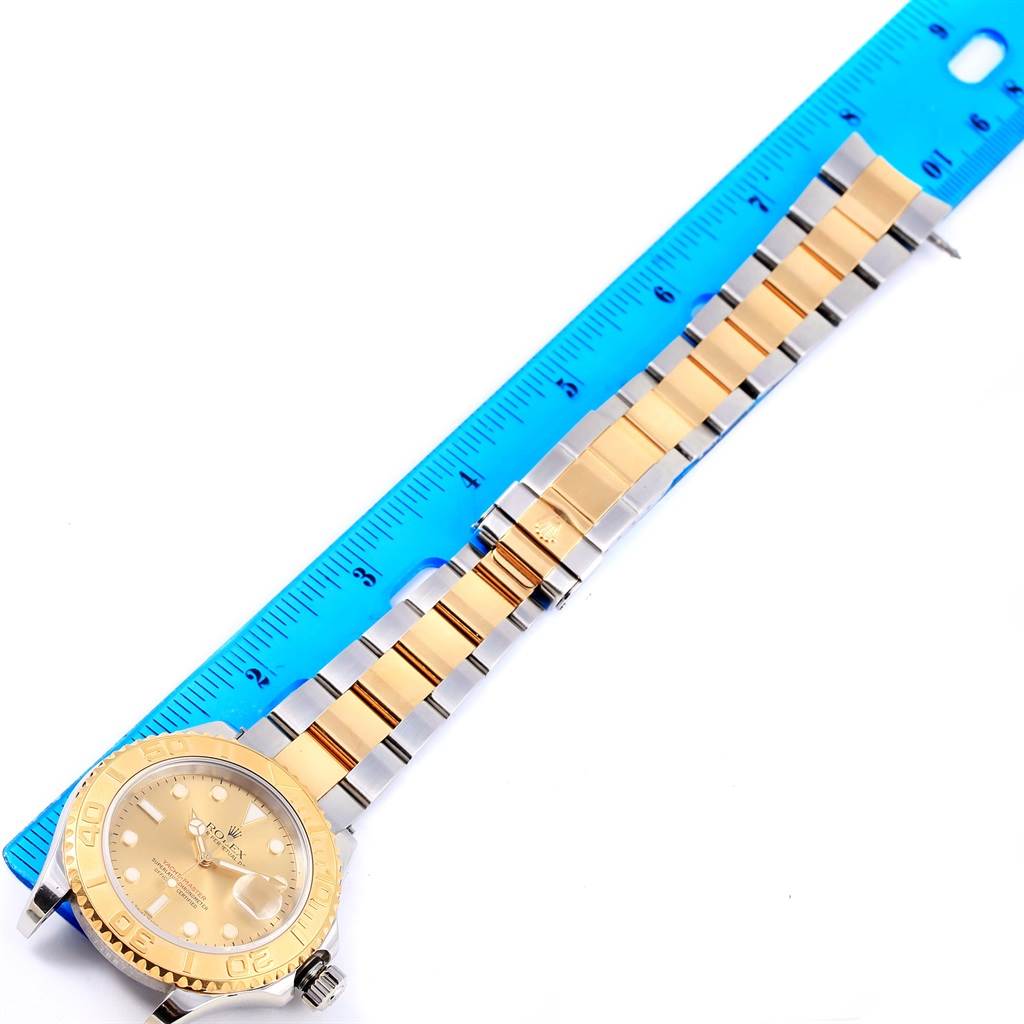 The image shows a Rolex Yacht-Master 16623 Men's Stainless Steel Champagne Dial 16623 Men's Stainless Steel Champagne Dial watch laid flat with a ruler beside it, displaying the watch face and bracelet.