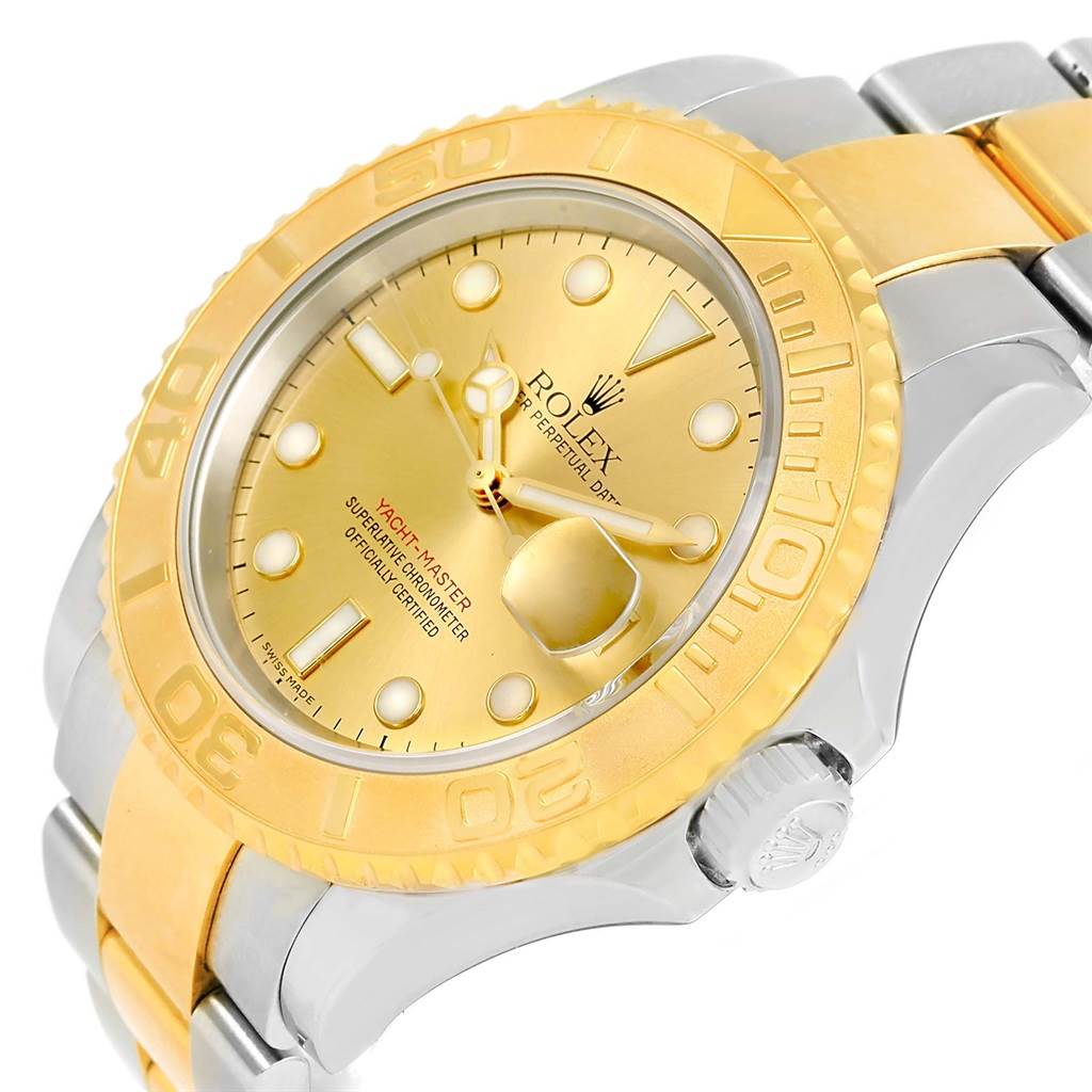 The Rolex Yacht-Master 16623 Men's Stainless Steel Champagne Dial 16623 Men's Stainless Steel Champagne Dial watch is shown from an angled close-up, highlighting its gold bezel, dial, and part of the bracelet.
