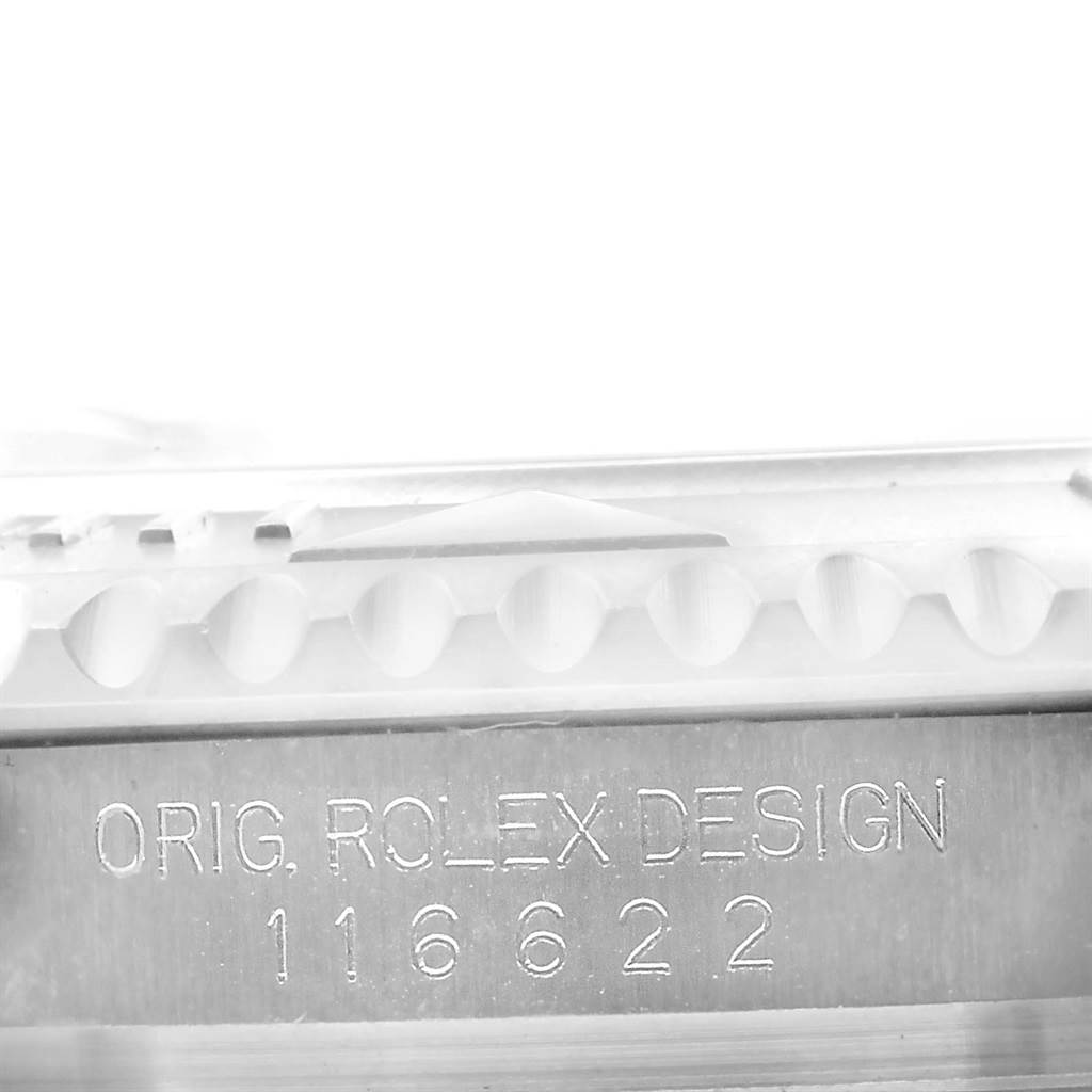The image shows the engraved serial number and part of the bezel of a Rolex Yacht-Master 116622 Men's Stainless Steel Blue Dial 116622 Men's Stainless Steel Blue Dial watch.