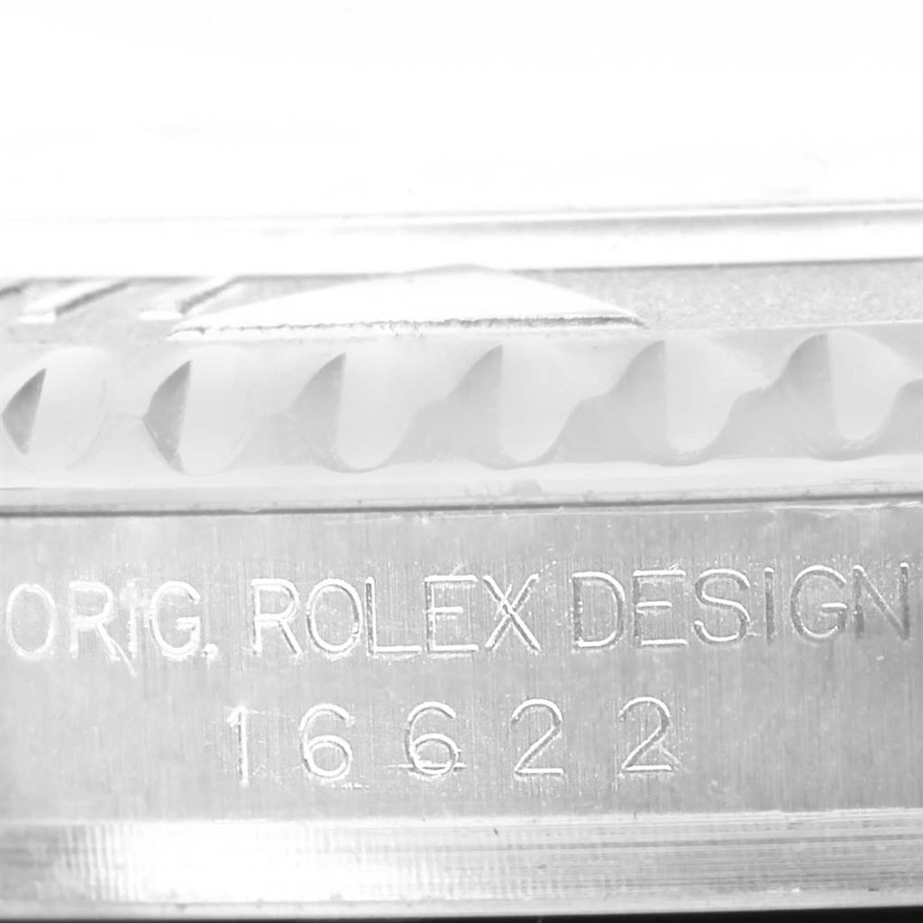 The image shows a close-up of the side of a Rolex Yacht-Master 16622 Men
s Stainless Steel Silver Dial 16622 Men
s Stainless Steel Silver Dial watch, highlighting its bezel and engraved model number 16622.