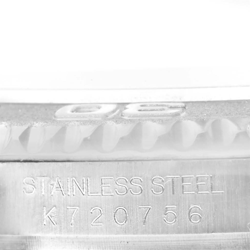 This image shows the serial number and "STAINLESS STEEL" engraving on the case edge of a Rolex Yacht-Master 16622 Men
s Stainless Steel Silver Dial 16622 Men
s Stainless Steel Silver Dial watch.