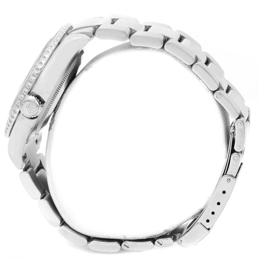 This image shows a side angle of the Rolex Yacht-Master 16622 Men
s Stainless Steel Silver Dial 16622 Men
s Stainless Steel Silver Dial watch, highlighting its case, crown, and bracelet.