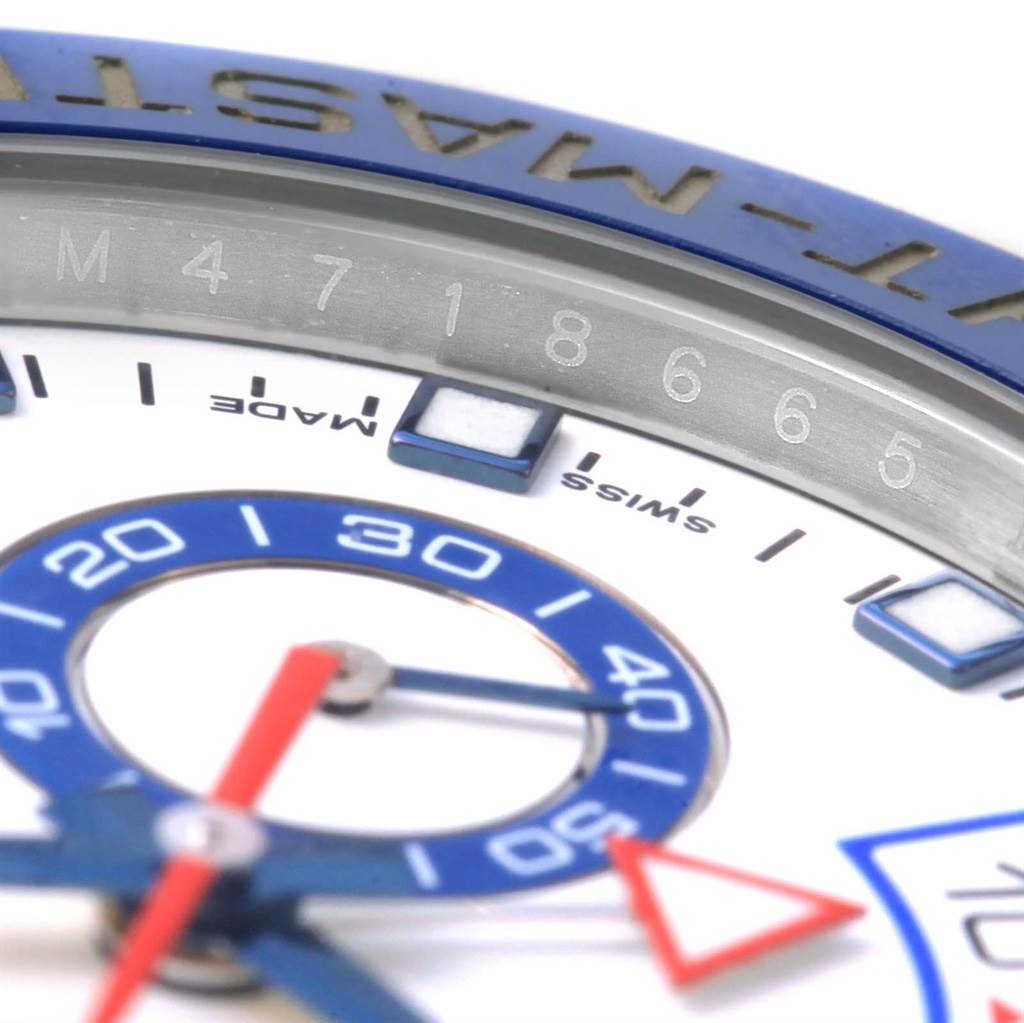 The image shows a close-up of the dial and part of the bezel of a Rolex Yacht-Master 116680 Men's Stainless Steel White Dial 116680 Men's Stainless Steel White Dial watch, highlighting its details and lettering.