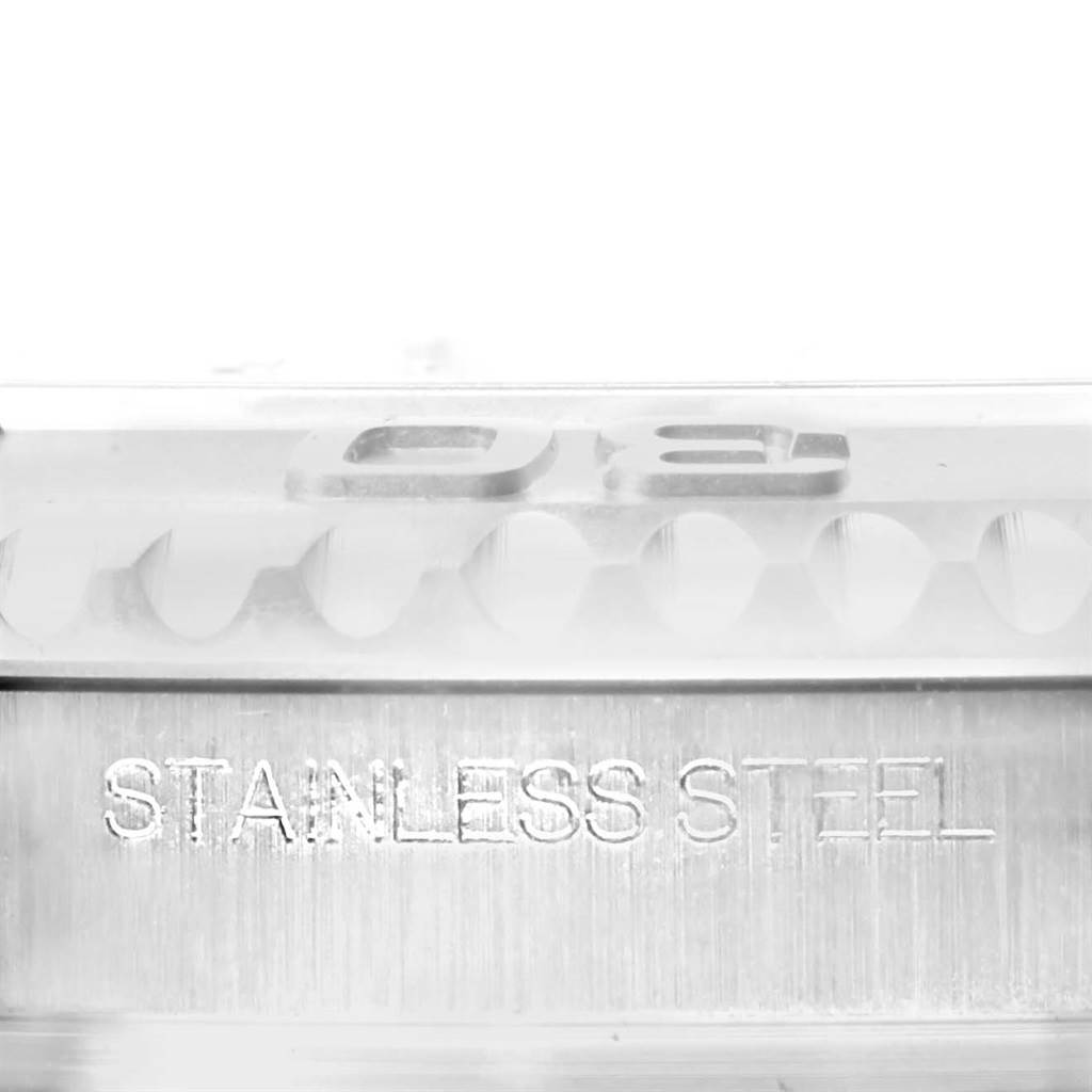 The image shows a close-up of the engraved "STAINLESS STEEL" text on the side of a Rolex Yacht-Master 116622 Men's Stainless Steel Blue Dial 116622 Men's Stainless Steel Blue Dial watch bezel.