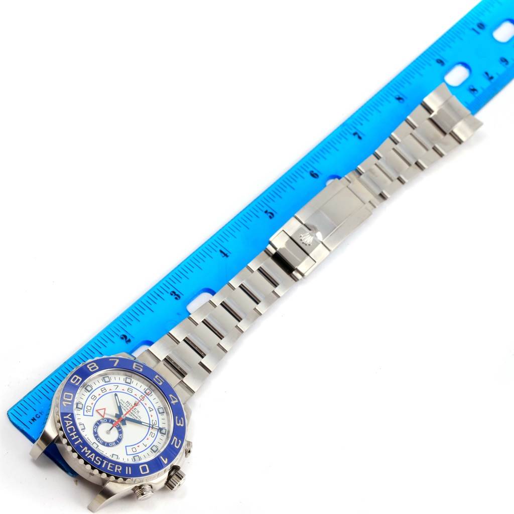 The image shows a Rolex Yacht-Master 116680 Men's Stainless Steel White Dial 116680 Men's Stainless Steel White Dial watch laid flat next to a blue ruler, displaying the bracelet and face.
