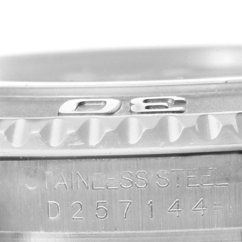 This image shows a close-up of the bezel and part of the case with the engraved serial number of a Rolex Yacht-Master 16622 Men's Stainless Steel Silver Dial 16622 Men's Stainless Steel Silver Dial watch.