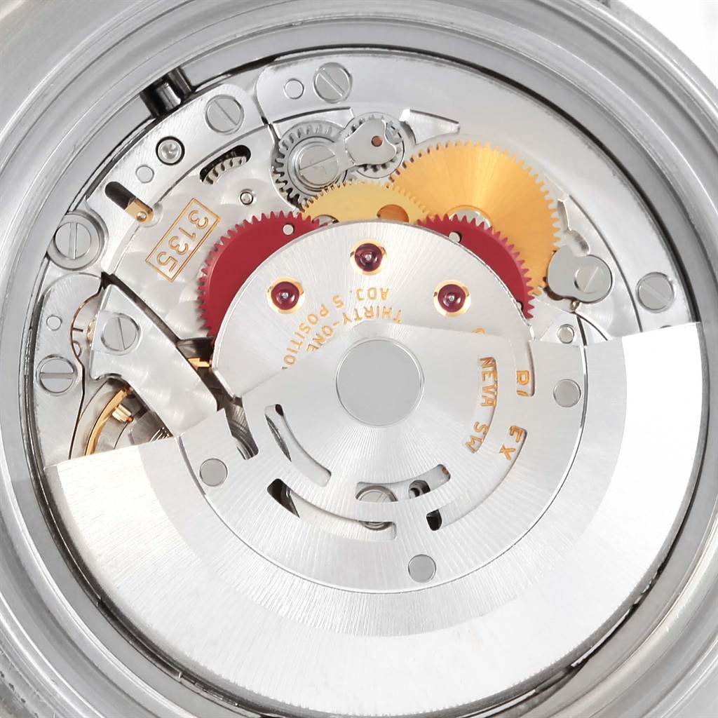 This image shows a close-up view of the internal mechanism of the Rolex Yacht-Master 16622 Men's Stainless Steel Silver Dial 16622 Men's Stainless Steel Silver Dial watch, highlighting its gears and movement.