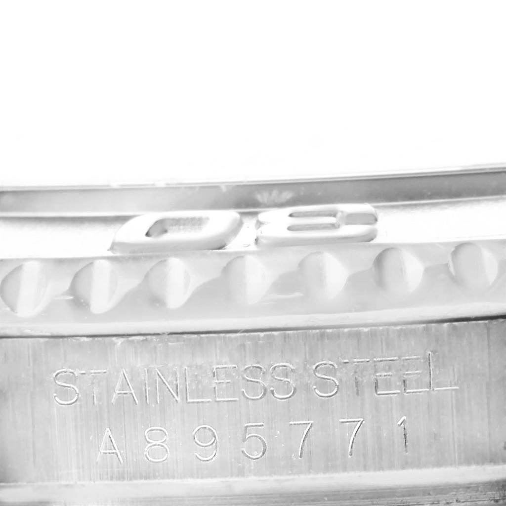 Close-up of the Rolex Yacht-Master 16622 Men's Stainless Steel Silver Dial 16622 Men's Stainless Steel Silver Dial bezel and serial number engraving on stainless steel.