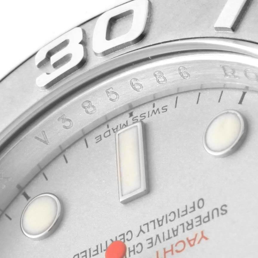 The image shows a close-up of the Rolex Yacht-Master 16622 Men's Stainless Steel Silver Dial 16622 Men's Stainless Steel Silver Dial watch face, focusing on the bezel, part of the dial, and hour markers.