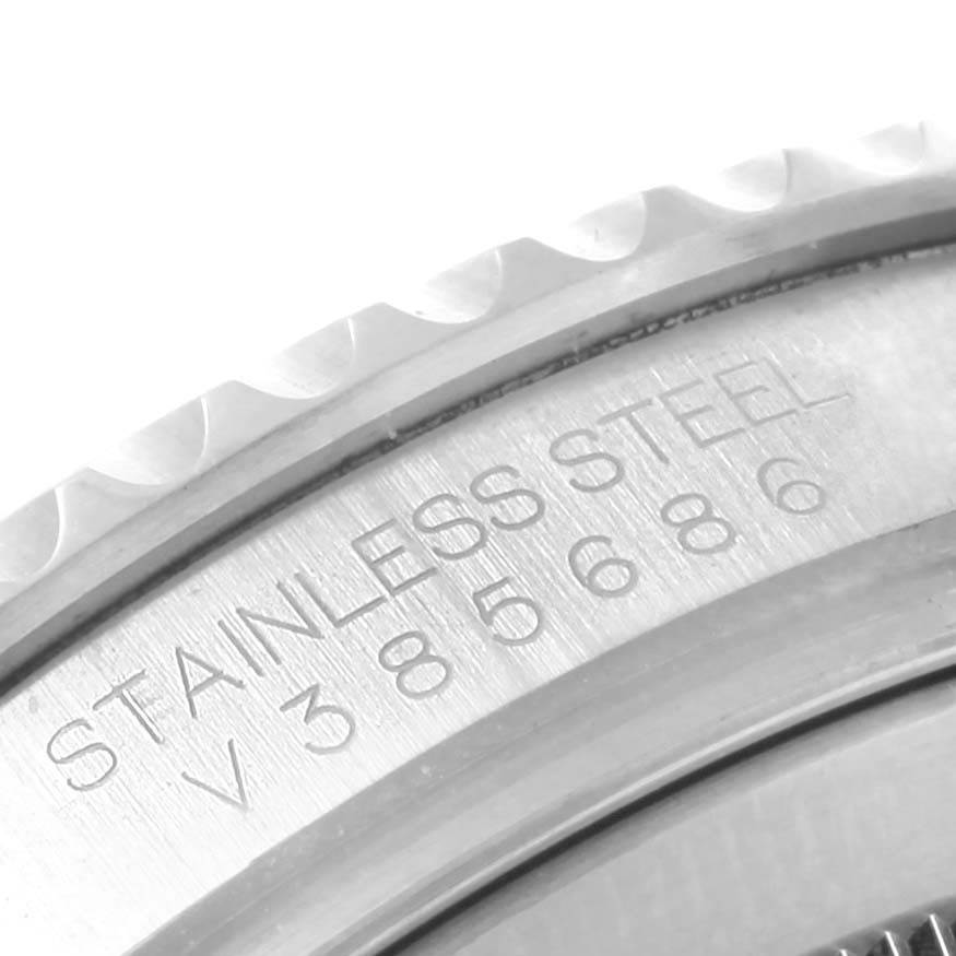 Close-up angle of the Rolex Yacht-Master 16622 Men's Stainless Steel Silver Dial 16622 Men's Stainless Steel Silver Dial watch case, focusing on the engraved stainless steel text and part of the bezel.