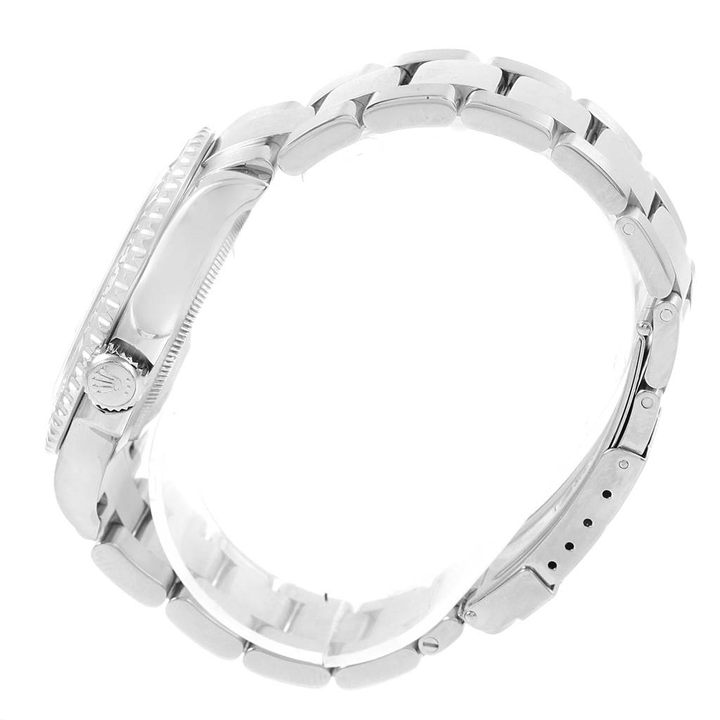 This side view of the Rolex Yacht-Master 16622 Men's Stainless Steel Silver Dial 16622 Men's Stainless Steel Silver Dial watch shows its crown, bezel, and bracelet.