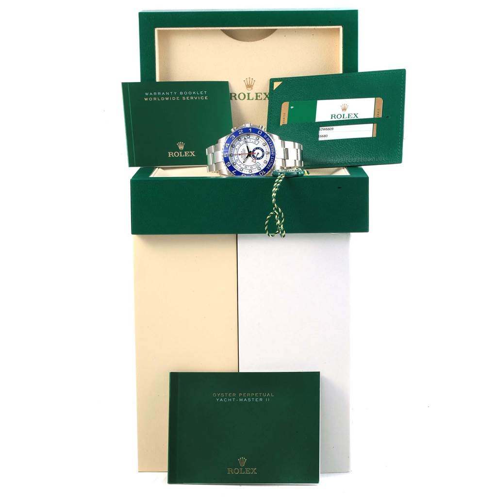 The image shows a Rolex Yacht-Master 116680 Men's Stainless Steel White Dial 116680 Men's Stainless Steel White Dial watch with its open box, warranty booklet, hang tag, and instruction manual, all displayed from the front.