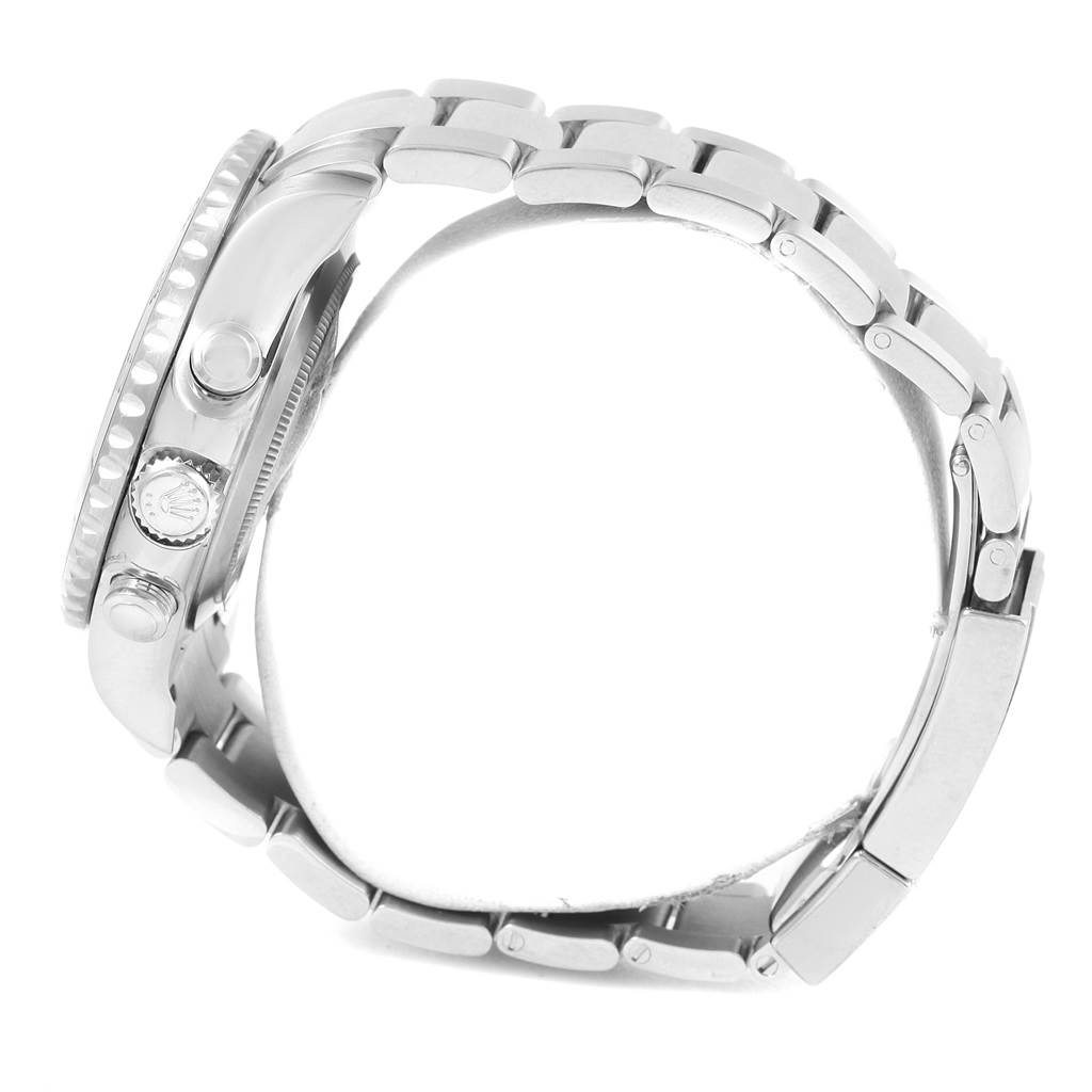 The image shows a Yacht-Master Rolex watch in a side profile, highlighting the crown, pushers, and the metal bracelet.