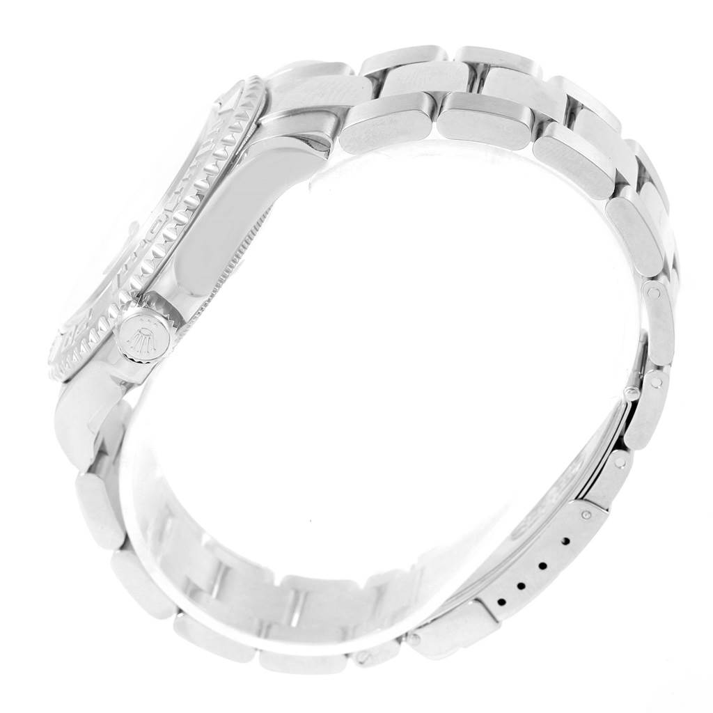 The image shows a Yacht-Master Rolex watch from a side angle, highlighting the bracelet, clasp, and side of the case with the crown.