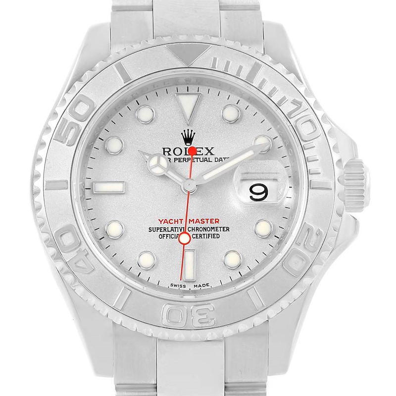 The Rolex Yacht-Master watch is shown from a front angle, displaying its face, bezel, and part of the bracelet.