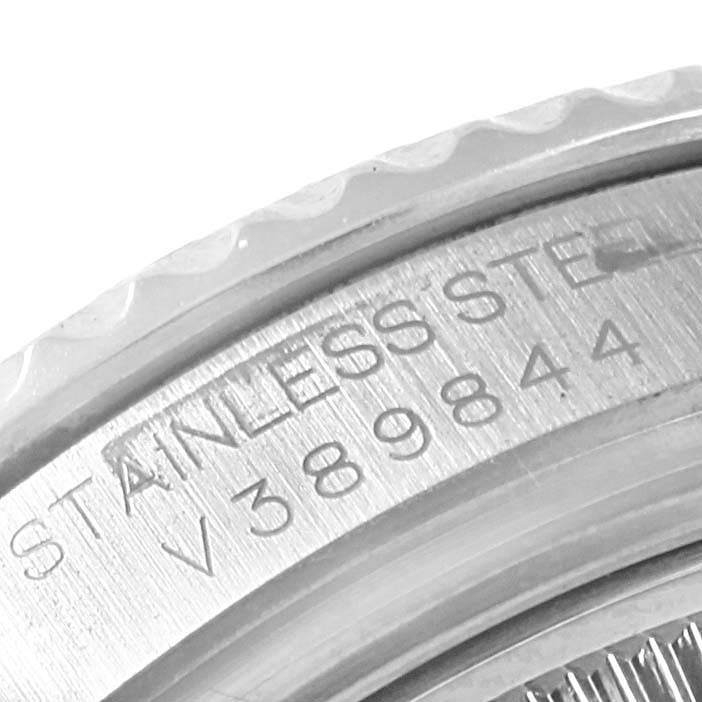 This close-up image shows the engraved serial number and "STAINLESS STEEL" text on the case back rim of a Rolex Yacht-Master 168622 Men's Stainless Steel Silver Dial 168622 Men's Stainless Steel Silver Dial watch.