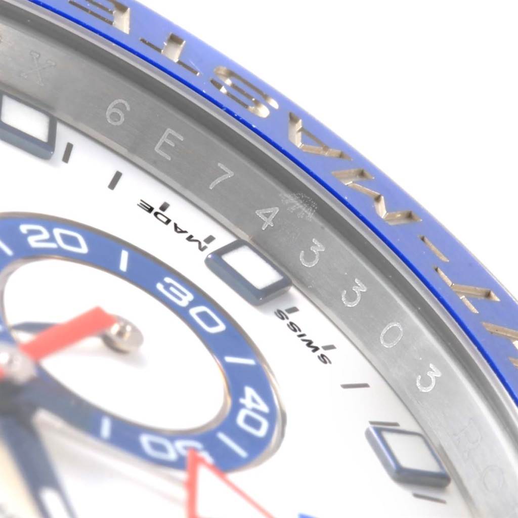 The image shows a close-up of the Rolex Yacht-Master 116680 Men's Stainless Steel White Dial 116680 Men's Stainless Steel White Dial's bezel, part of the dial, and some indices.