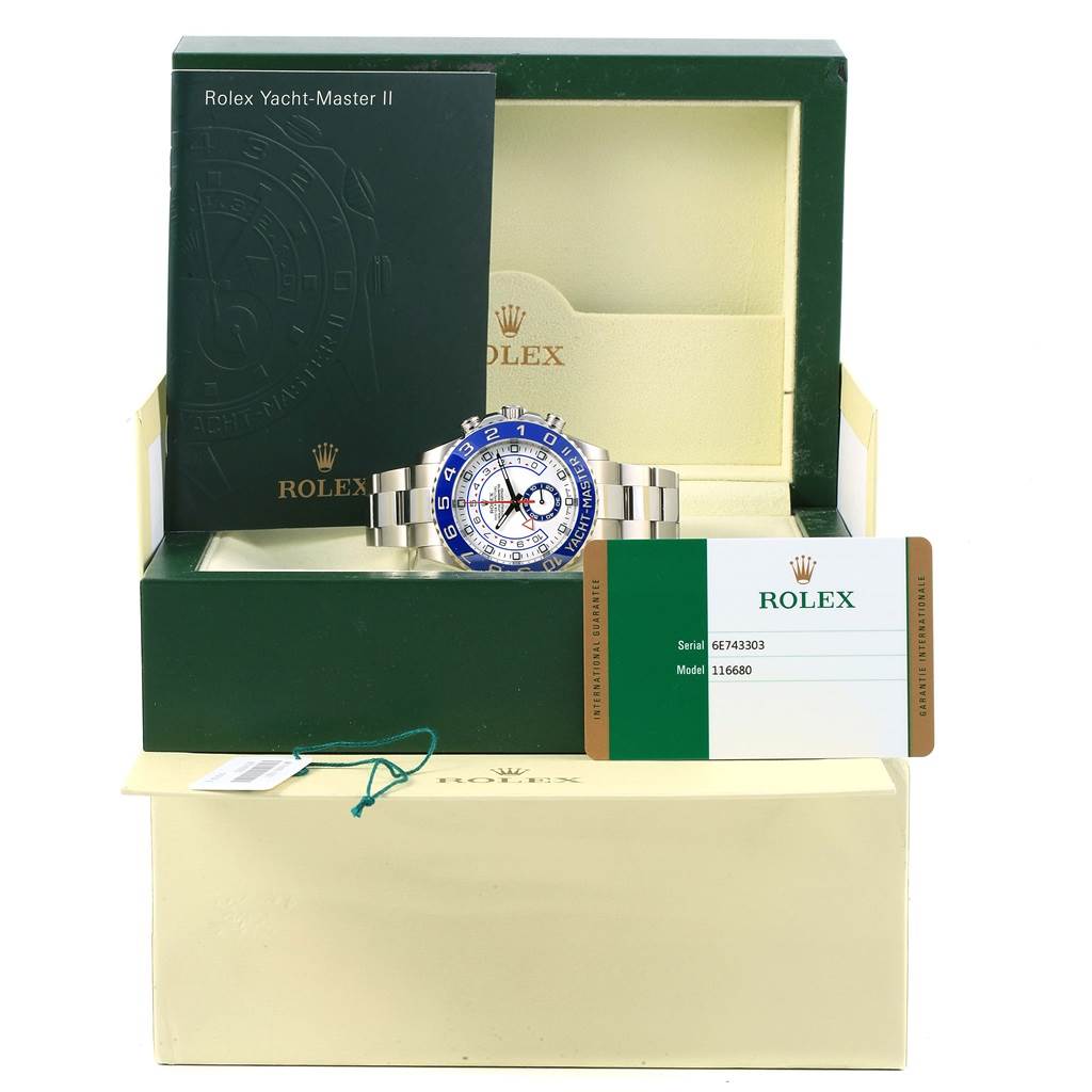 The image shows a front view of a Rolex Yacht-Master 116680 Men's Stainless Steel White Dial 116680 Men's Stainless Steel White Dial II watch with its box, booklet, and authenticity card.